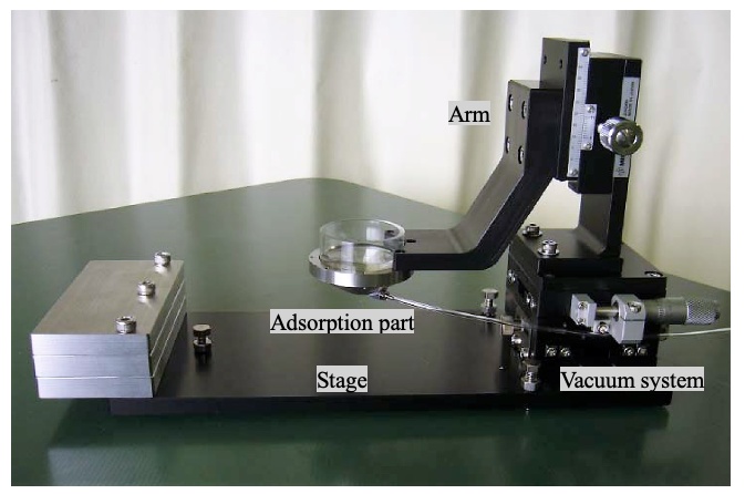 Photo showing the suction system of the mouse adsorption fixing device for intravital observation expriments 